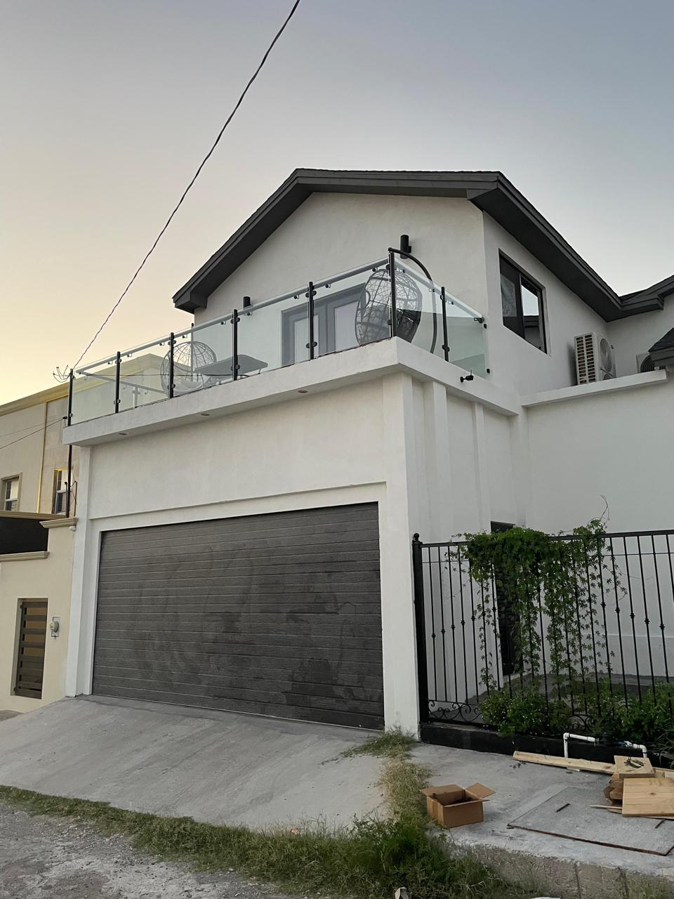 Glass balcony railing on a residential project by FerMac